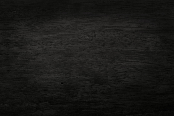 Zwarte houten muur achtergrond, textuur van donkere schors hout met oude natuurlijke patroon voor design kunst werk, bovenaanzicht van graan hout. - Foto, afbeelding