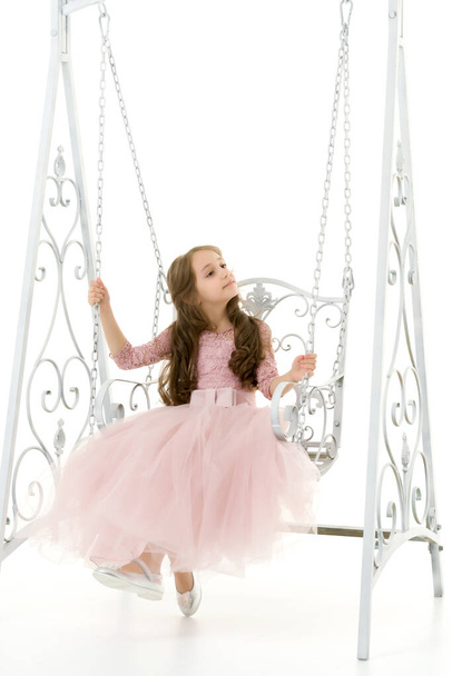 Beautiful Preteen Girl Sitting on Elegant Metal Swing - Foto, Bild
