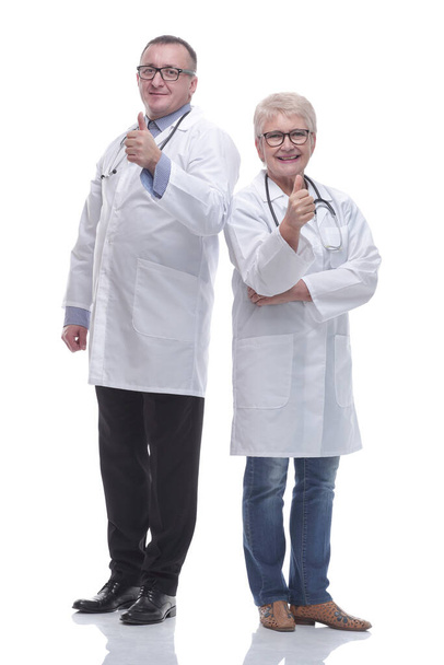 in full growth. two medical colleagues showing thumbs up - Фото, зображення