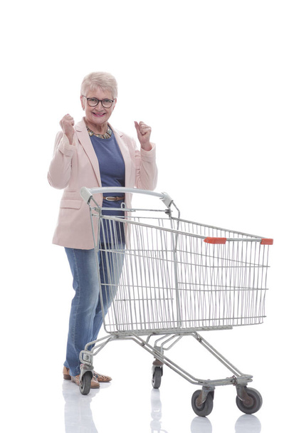 in full growth. a very happy old woman with a shopping cart - Photo, Image