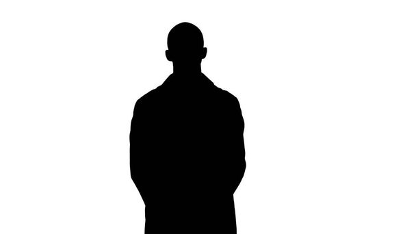 Silhouette Standing young serious arab doctor. - Foto, imagen