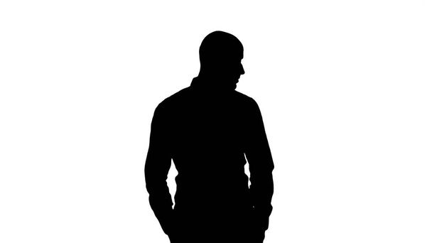 Silhouette Arab in casual looking around with hands in pockets. - Φωτογραφία, εικόνα