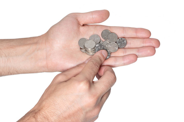 Monety w rękach. Ręczne trzymanie monet. Ukraińskie pieniądze. - Zdjęcie, obraz