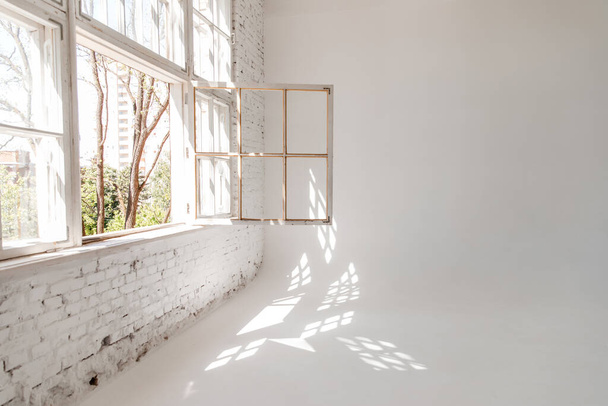 Empty open plan office. A white loft with a large open window. photographic studio. - Fotó, kép