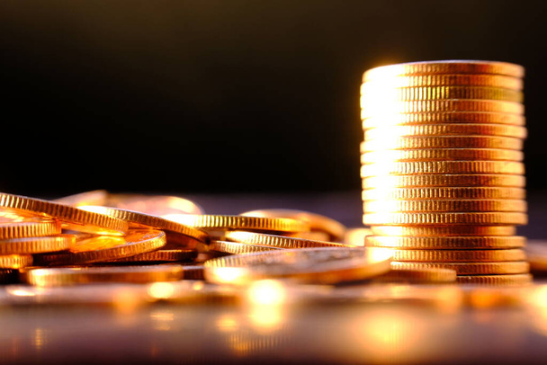 stack of coins on a blurred background  - Zdjęcie, obraz