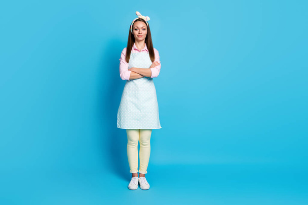 Full length photo of attractive pretty lady long hairdo self-confident cleaning service maid worker arms crossed smiling wear headband apron shirt pants shoes isolated blue color background - Photo, image