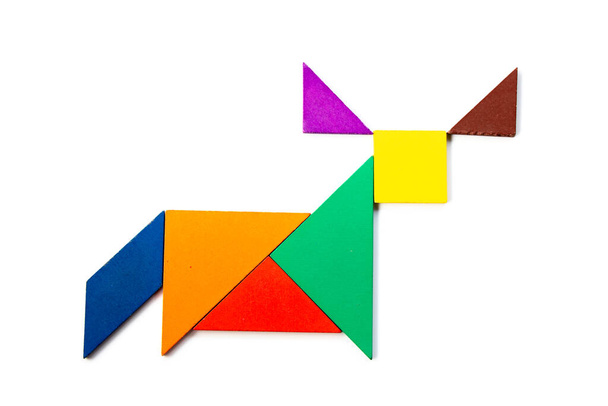 Color wood tangram puzzle in ox, buffalo or bull shape on white background - Photo, Image