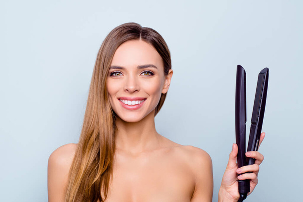 Close up photo portrait of cute pretty attractive brunette she her lady holding curl iron in hand recommending new protecting from harmful influence iron isolated on grey background - Fotoğraf, Görsel