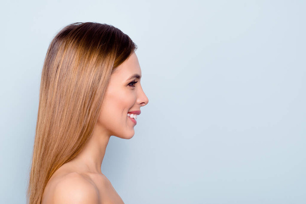 Profile side view portrait of nice attractive groomed straight-haired cheerful positive glad lady with shine clean clear flawless skin copy empty blank space isolated over light gray pastel background - 写真・画像