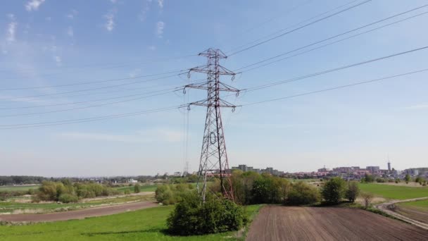 Power pylons and high voltage lines in an agricultural landscape. High-voltage masts. Electricity transmission power lines.4K, UHD, Cinematic, Aerial footage - Footage, Video