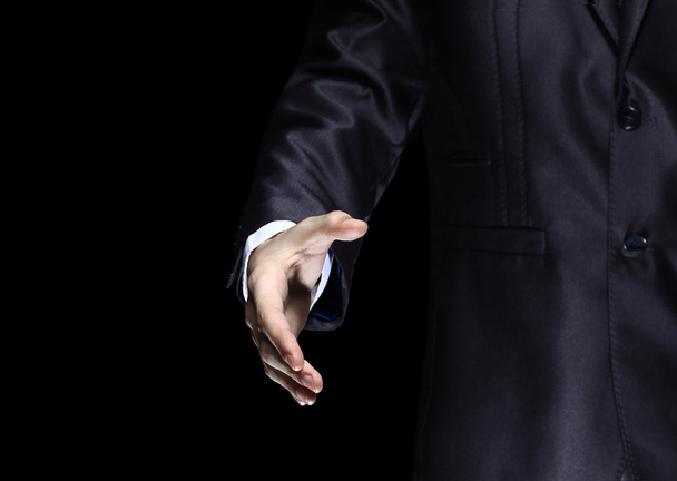 Businessman offering for handshake on office buildings background - Photo, Image