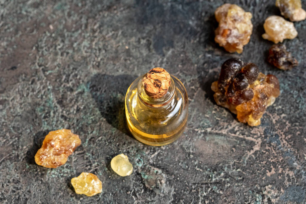 A bottle of frankincense essential oil with boswellia resin - Valokuva, kuva
