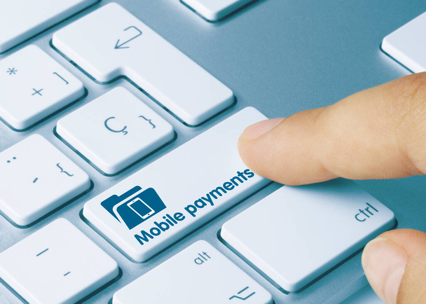 Mobile payments Written on Blue Key of Metallic Keyboard. Finger pressing key. - Photo, Image