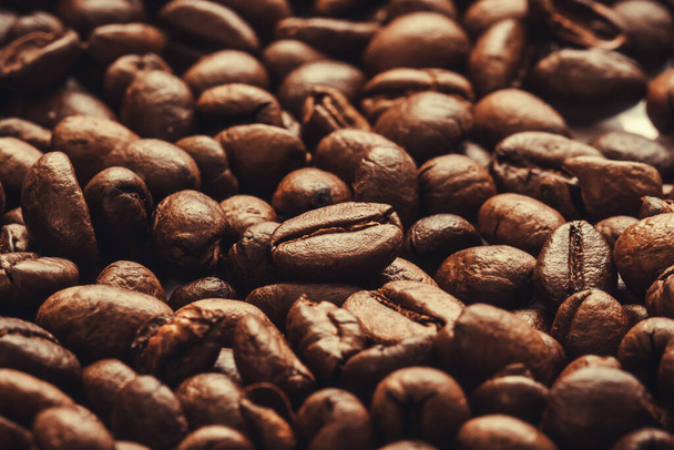 Roasted coffee beans background. international day of coffee. Close up. Selective focus.. - Photo, Image