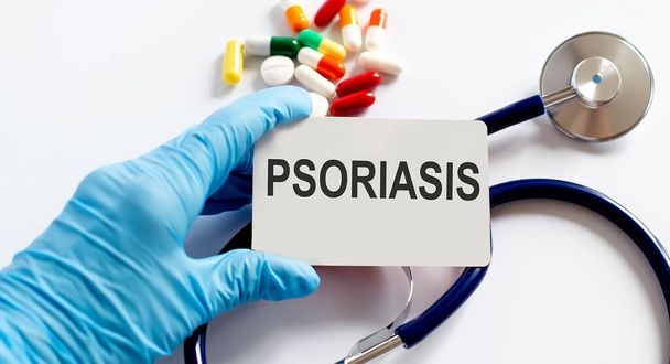 Card with text PSORIASIS supplies, pills,stethoscope. Medical concept. - Photo, Image