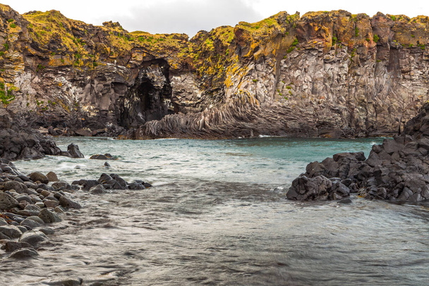 Rocky basalt cliffs on the south coast of the Snaefellsnes peninsula. Londrangar rock formation. Arnarstapi, Western Iceland. - Photo, Image