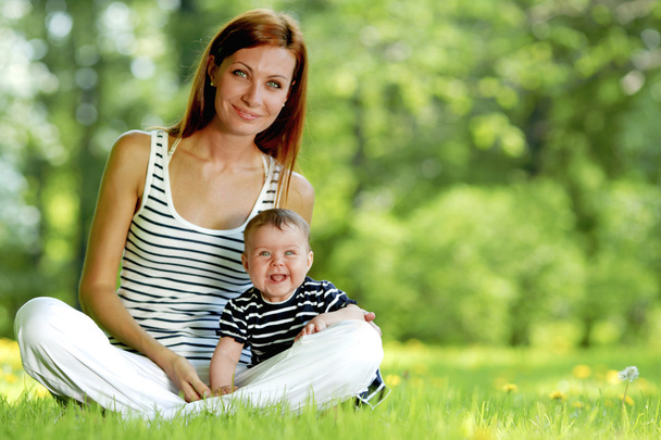 Mother and daughter on grass - Photo, image