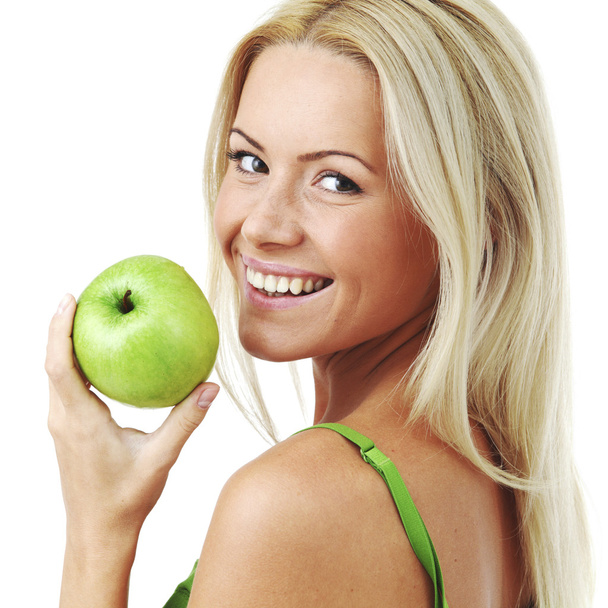 Woman holding green apple - Foto, afbeelding