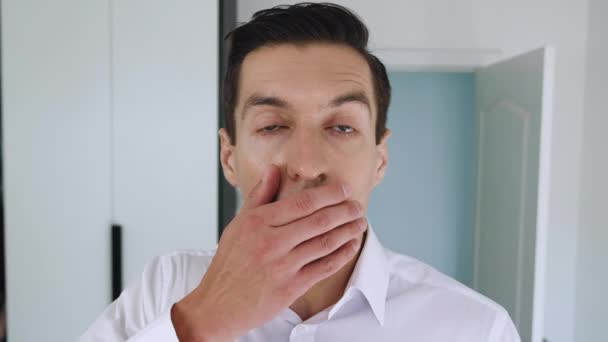 Portrait of frightened businessman shocked and covers his mouth in surprise. The concept is an unpleasant surprise. The man is suddenly terrified. - Footage, Video