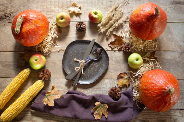 Thanksgiving Day. Thanksgiving pumpkin on a wooden background. autumn holiday. Dinner. thanksgiving. View from above. Copspace - Photo, Image