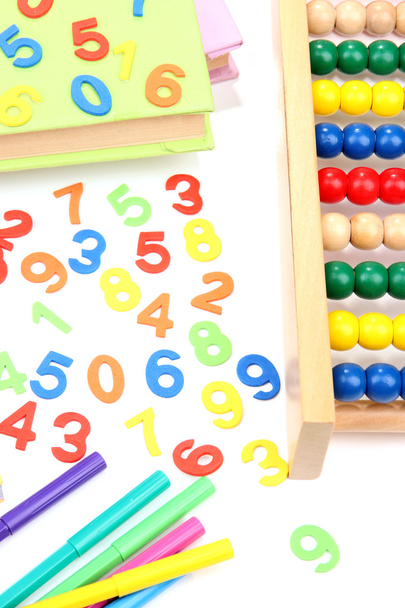 Colorful numbers, abacus, books and markers, isolated on white - Foto, afbeelding