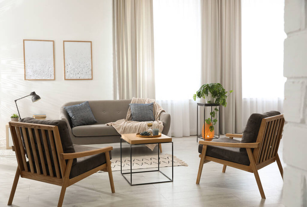 Modern living room interior with comfortable sofa and armchairs - Zdjęcie, obraz