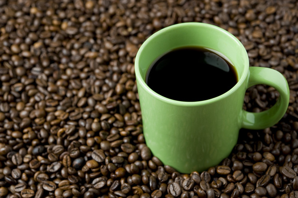 Coffee cup on coffee beans - Fotó, kép