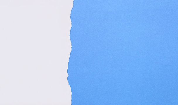 Blue Art paper of overlapping and tearing for background design.  - Фото, изображение