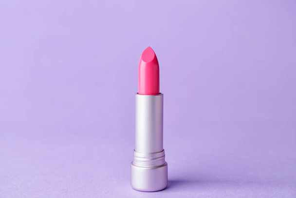 Beautiful lipstick on color background - Foto, afbeelding