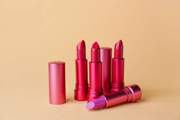 Different lipsticks on color background - Photo, Image