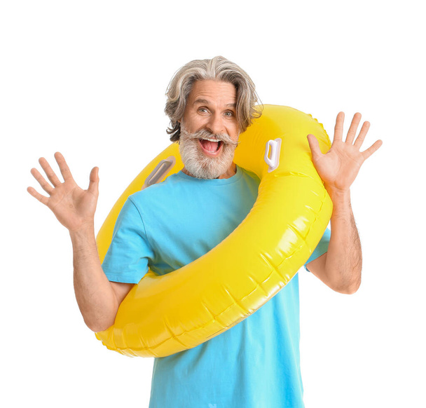 Mature man with inflatable ring on white background - Foto, immagini