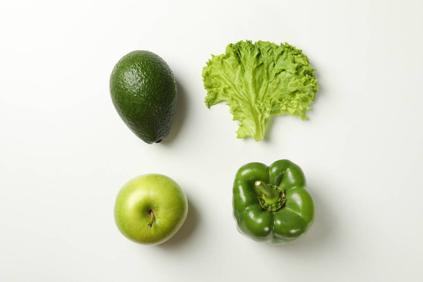 Avocado, apple, salad and pepper on white background - Foto, imagen