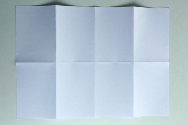 Folded white sheet of paper close up - Fotó, kép