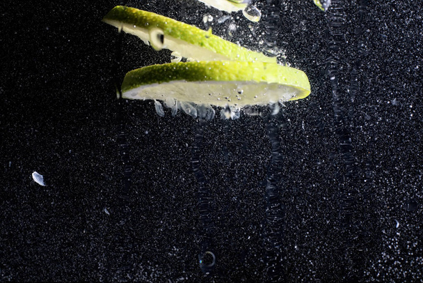 Water drops on ripe sweet lemon. Fresh lime  background with copy space for your text. Vegan and vegetarian concept. - Φωτογραφία, εικόνα
