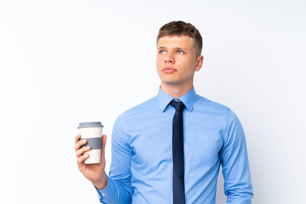 Молодой привлекательный бизнесмен на изолированном белом фоне - Фото, изображение