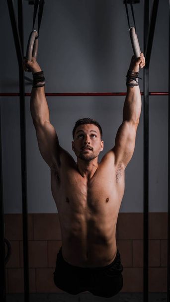 A vertical shot of an athletic male - Φωτογραφία, εικόνα