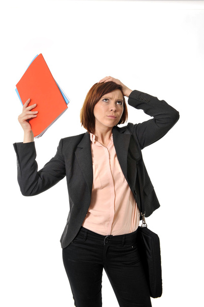 doubtful business woman or student with portfolio standing and thinking - Photo, Image