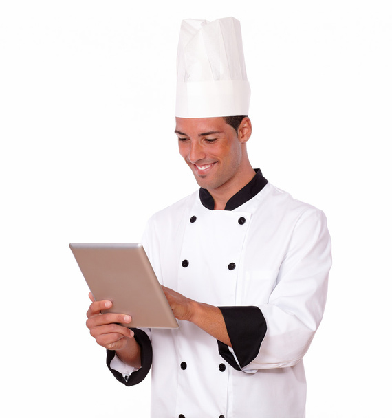 Handsome chef guy using his tablet pc - Foto, imagen