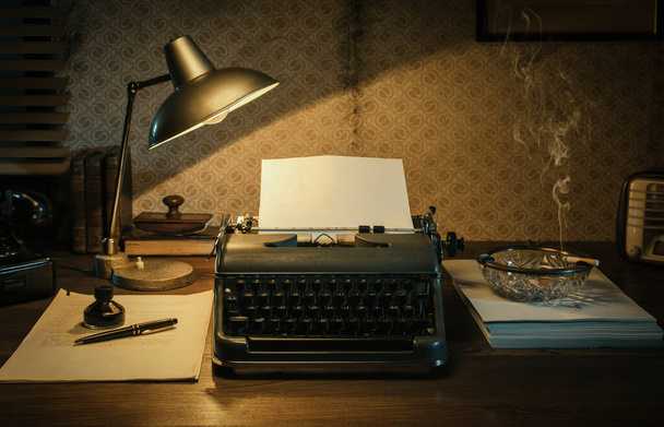 Office desk with vintage typewriter and blank sheet, 1950s film noir style - Foto, Bild