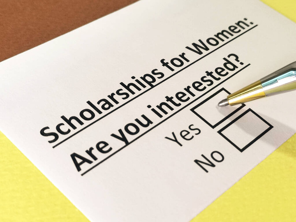 One person is answering question about scholarships for women. - Photo, Image
