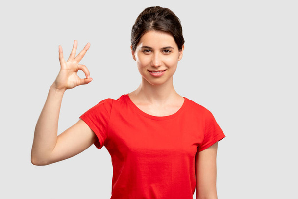 ok gesture approval sign happy woman - Foto, imagen
