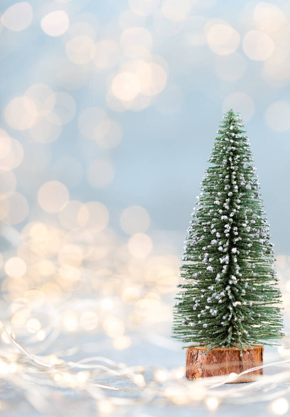 Christmas tree on bokeh background. Christmas holiday celebration concept. Greeting card.  - Фото, изображение