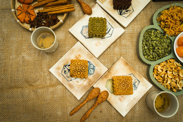 Flat lay mid autumn festival colorful food and drink on burlap background. Travel. holiday, food concept - Foto, imagen