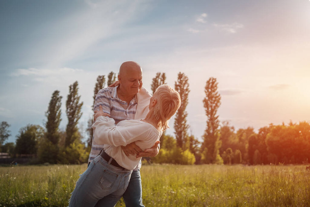 happy senior couple have romantic dating and dance at sunny day outdoor - Фото, зображення