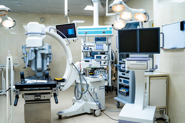 Equipment and medical devices in modern operating room. Operating theatre. Selective focus. - 写真・画像