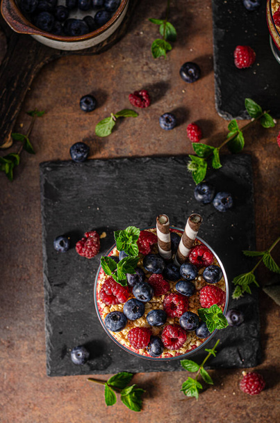 Vanilla panna cotta with berries and crunchy cookies - Fotó, kép