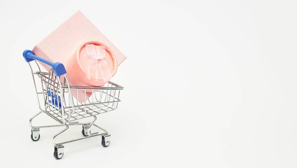 black friday concept, gift boxes with shopping trolley on white background, copy space - Photo, Image