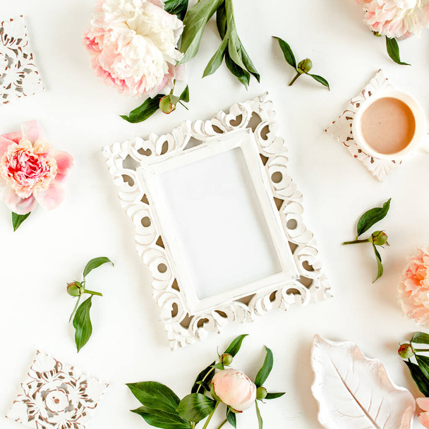 Carved, white frame decorated of beautiful pink peonies on white background. Flat lay, top view. Valentines background. Floral frame. Peony texture. - Фото, изображение