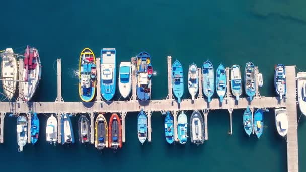Aerial view on boats moored in the pier, drone shot directly above. - Footage, Video