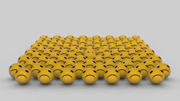 3D animation of many emoticons with a grimace of discontent and one appears with a smile. Yellow balls on a white background. - Footage, Video